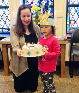 Mrs. Watkins and a student celebrate a birthday during morning chapel time.