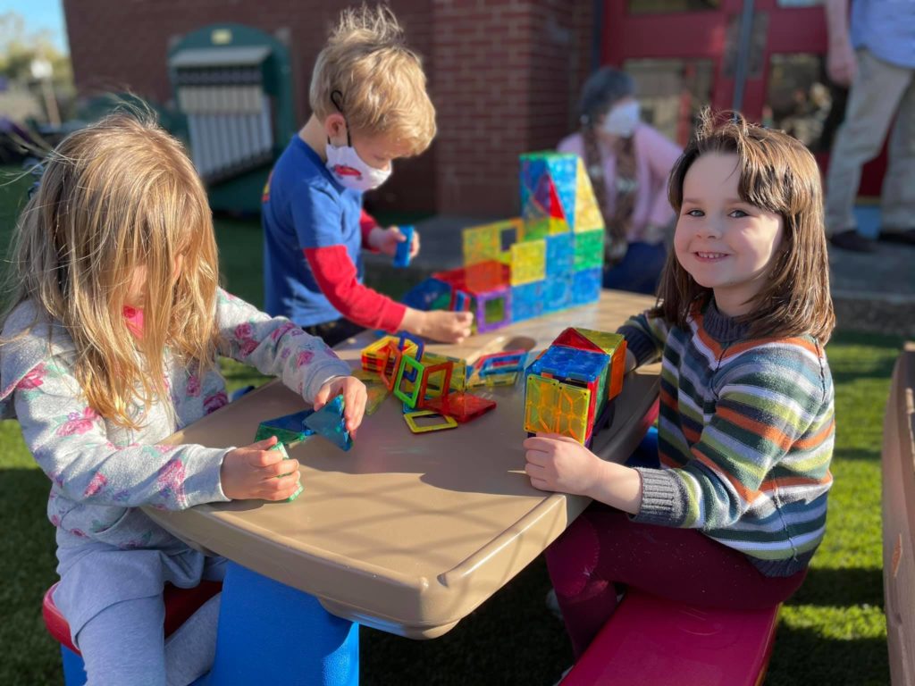 children playing with toys outside